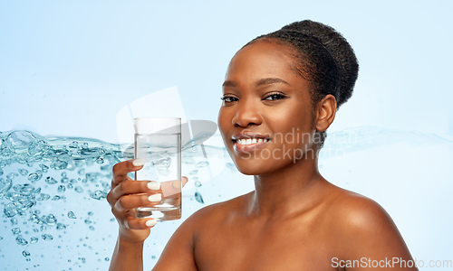 Image of young african american woman with glass of water