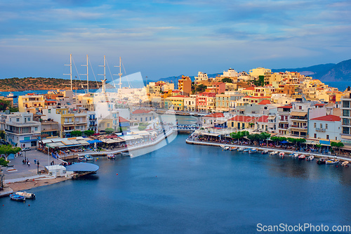 Image of Beautiful Agios Nikolaos town on lake Voulismeni on sunset. island Crete, Greece