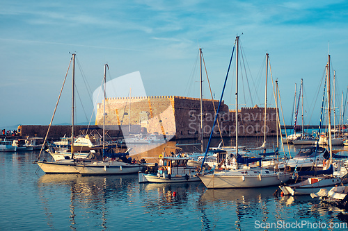 Image of Venetian Fort in Heraklion and moored fishing boats, Crete Island, Greece