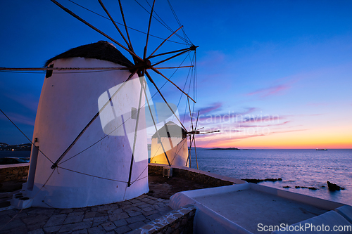 Image of Traditional greek windmills on Mykonos island at sunrise, Cyclades, Greece