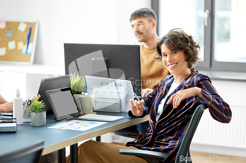 Image of smiling businesswoman at office conference