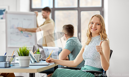 Image of smiling businesswoman at office conference