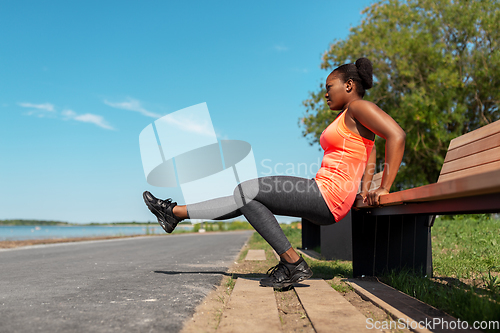 Image of african american woman doing sports at seaside