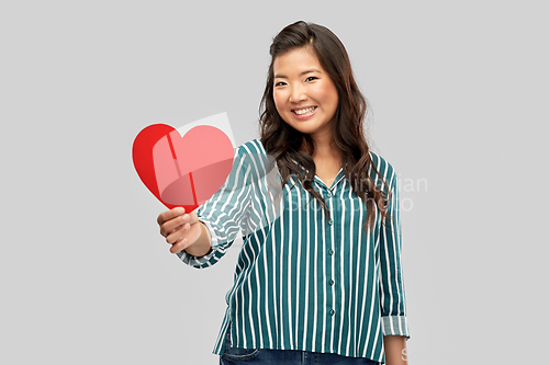 Image of happy asian woman with red heart