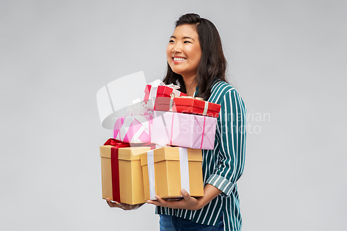 Image of happy asian woman with birthday present