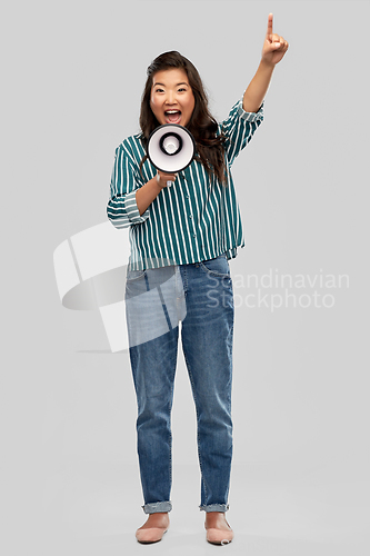 Image of asian woman speaking to megaphone