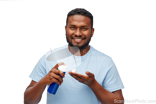 Image of happy african american man with shaving cream