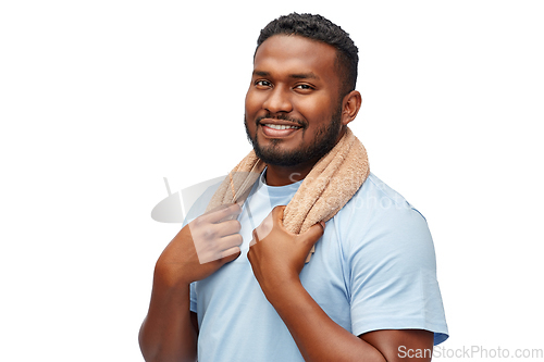 Image of smiling african man with bath towel