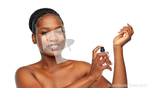 Image of young african american woman with perfume