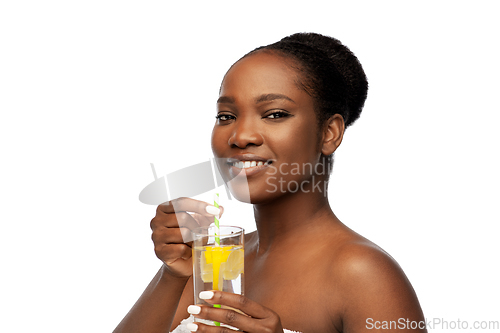 Image of african american woman with glass of fruit water