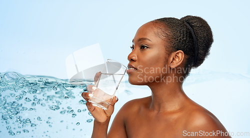 Image of young african american woman with glass of water