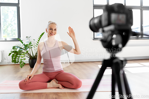 Image of woman or blogger recording gym yoga class video