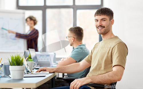Image of happy smiling man at office conference