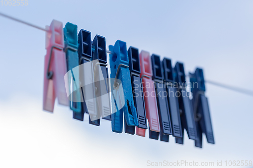 Image of cloth pegs with a under the blue sky