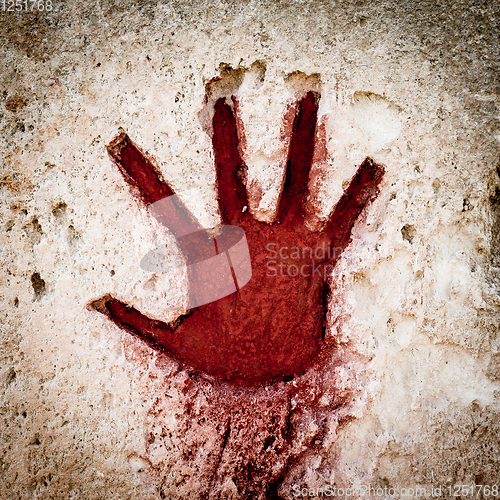 Image of Red hand on stone - graphic gothic element