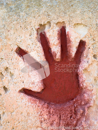 Image of Red hand on stone - graphic gothic element