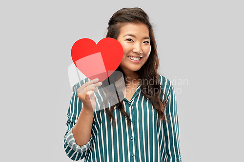 Image of happy asian woman with red heart