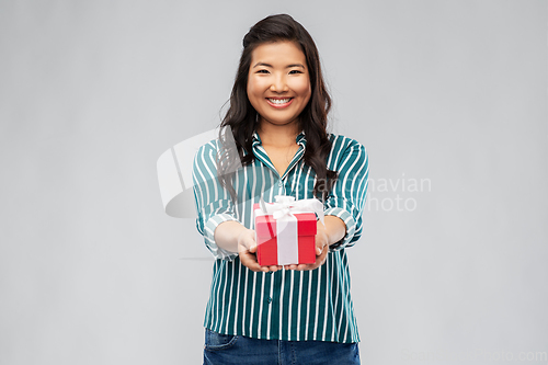 Image of happy asian woman with birthday present