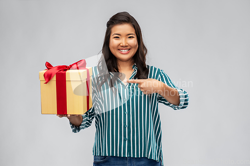 Image of happy asian woman with birthday present