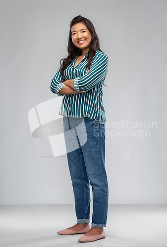 Image of happy smiling asian woman with crossed arms