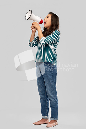 Image of asian woman speaking to megaphone