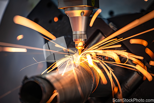 Image of CNC Laser cutting of metal, modern industrial technology.