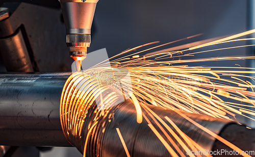 Image of CNC Laser cutting of metal, modern industrial technology.