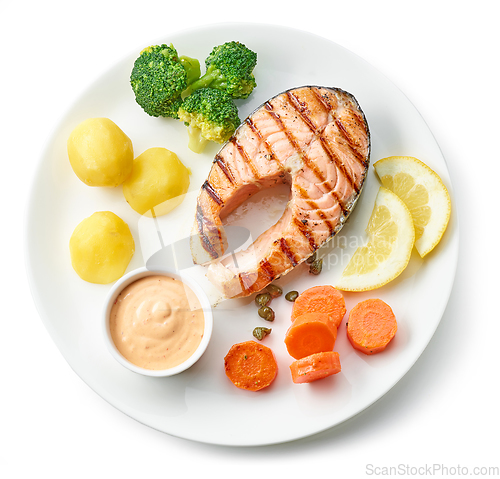 Image of plate of grilled salmon steak and vegetables