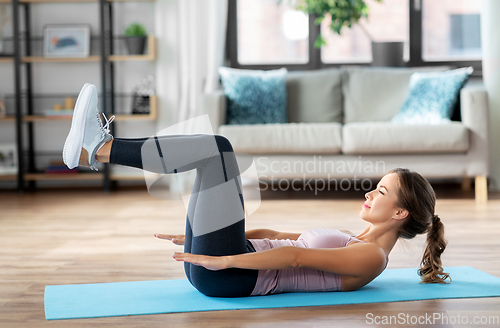 Image of woman exercising at home