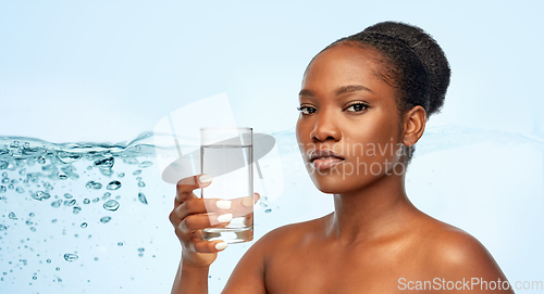 Image of young african american woman with glass of water