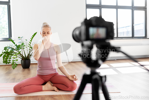 Image of woman or blogger recording gym yoga class video