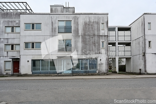 Image of old concrete house in a residential area 