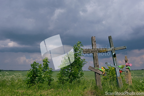 Image of Next to road crosses and cloudy blue sky