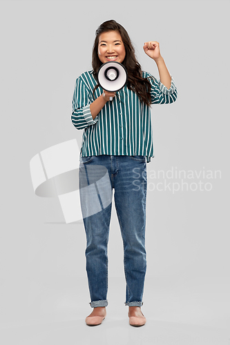 Image of happy smiling asian woman speaking to megaphone