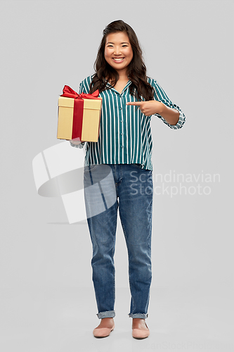 Image of happy asian woman with birthday present