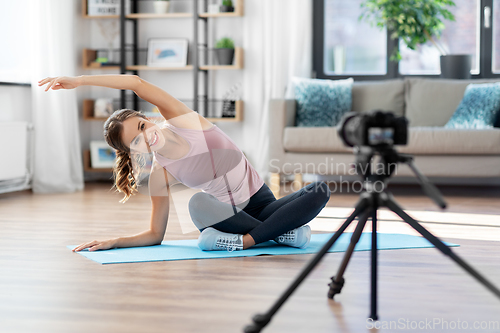 Image of woman or sports blogger streaming online yoga