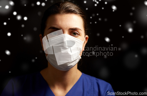 Image of female doctor or nurse in medical face mask