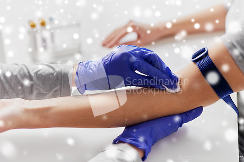 Image of doctor and patient preparing for blood test