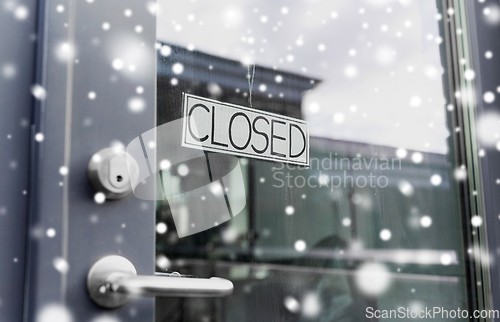 Image of glass door of closed shop or office