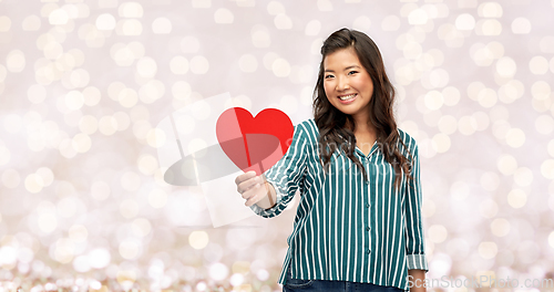 Image of happy asian woman with red heart over lights