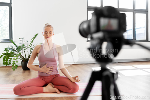 Image of woman or blogger recording gym yoga class video