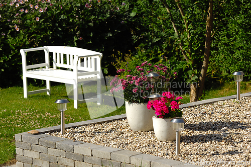 Image of Flowers in pots in the garden