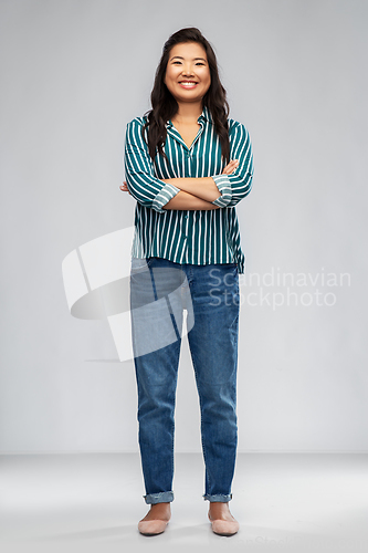 Image of happy smiling asian woman with crossed arms