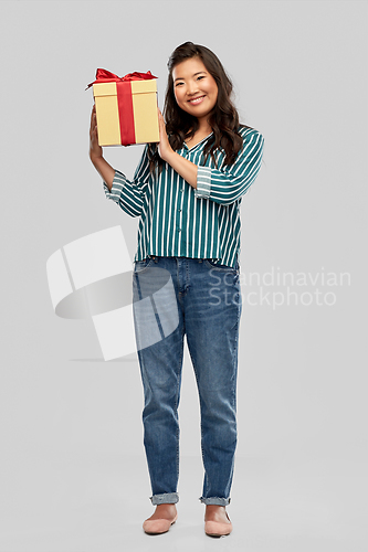 Image of happy asian woman with birthday present