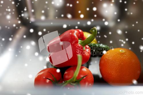 Image of close up of fruits and vegetables in kitchen sink