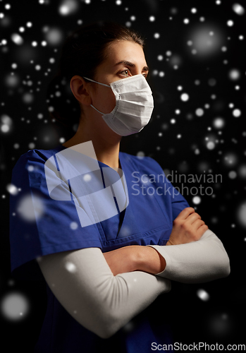 Image of female doctor or nurse in medical face mask