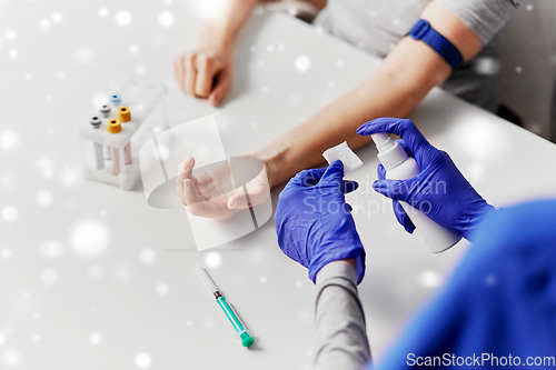 Image of doctor and patient preparing for blood test