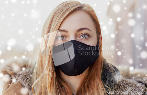 Image of woman wearing protective reusable barrier mask