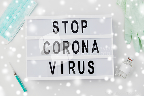 Image of lightbox with stop coronavirus caution words