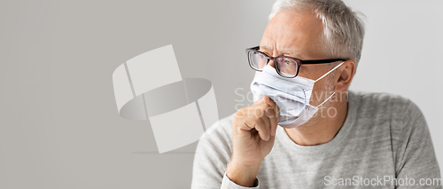 Image of close up of senior man in glasses and medical mask